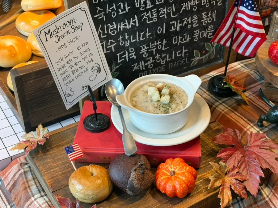 Soups sold at Orange Bagel, including mushroom