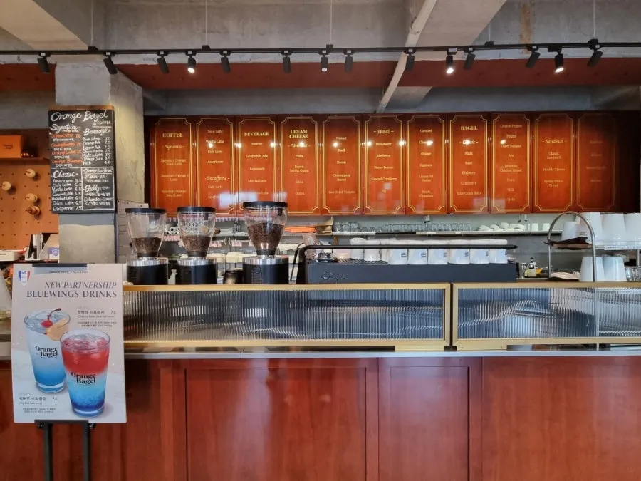 Customers seated in Orange Bagel's first-floor hall