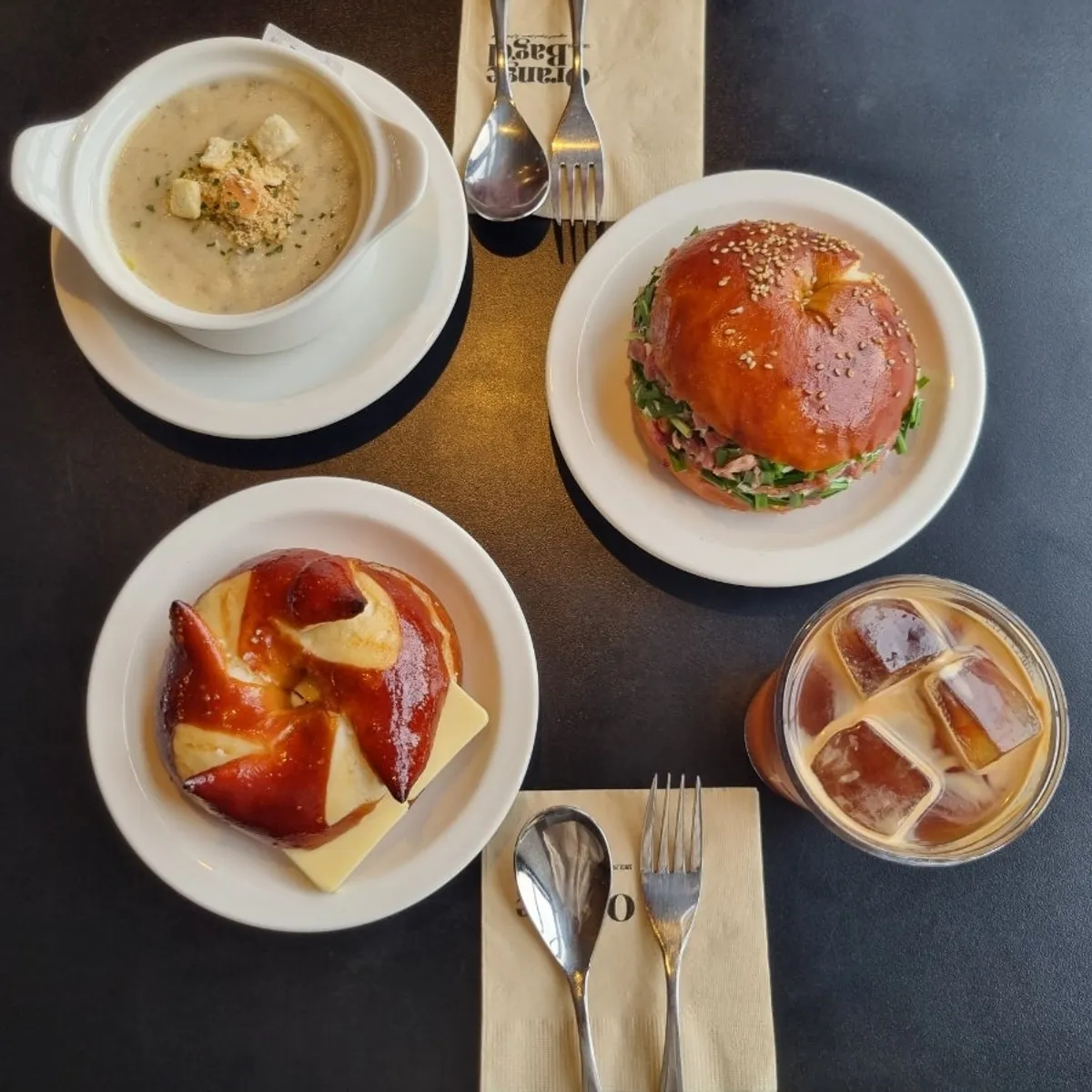 A brunch spread of Laugen butter bagel and scallion cream bacon