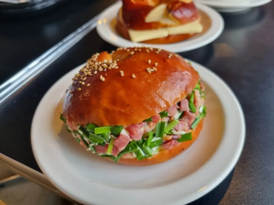Cross-section of the scallion cream bacon bagel