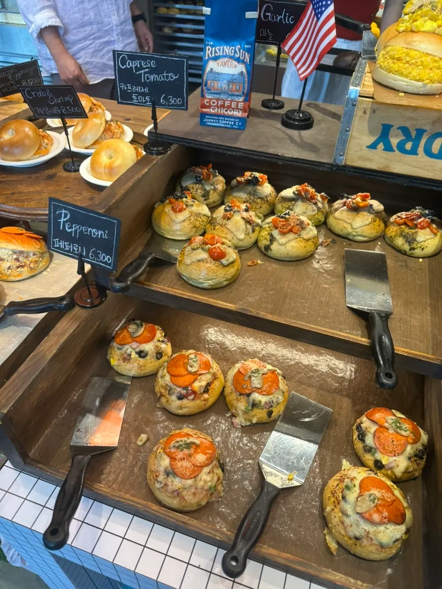 Display case with red bean butter, sesame, and jambon bagels