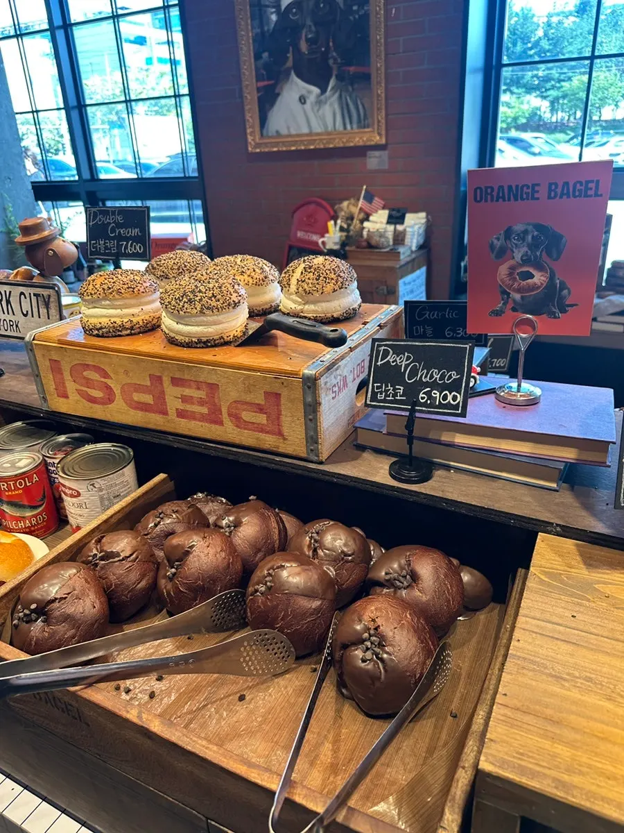 Display of bagel varieties at Orange Bagel