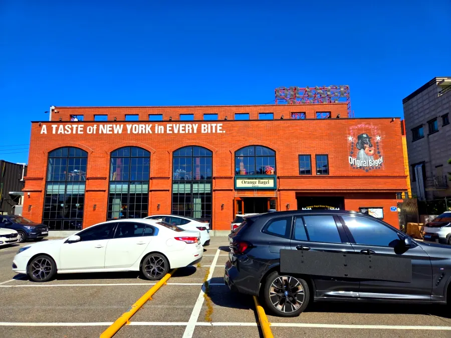 View of Orange Bagel's dedicated free parking lot