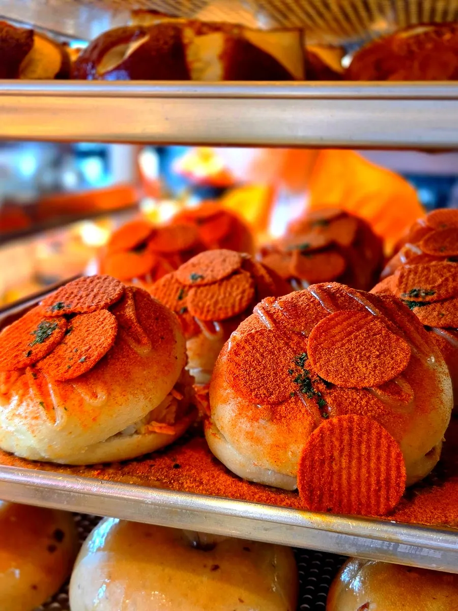 Plain, blueberry and other basic bagels on display