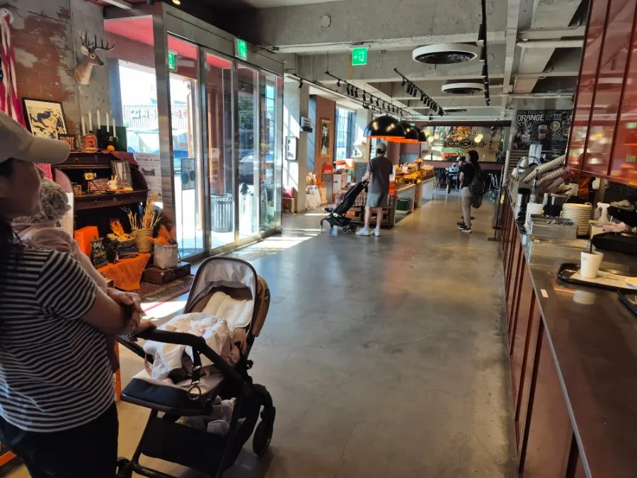 Wide-open interior of Orange Bagel's 1st floor hall