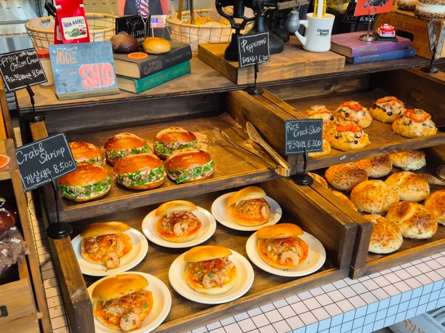 Lineup of Orange Bagel's bagel menu