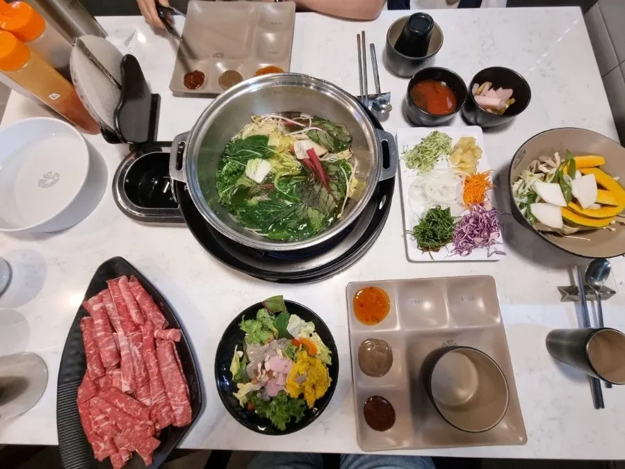 A plate of salad and rice paper roll vegetables