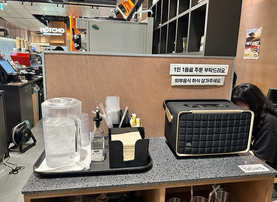 Self-bar with water, napkins, and straws