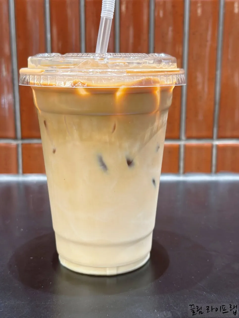 Cup printed with the Jeong Jiyeong Coffee Roasters logo