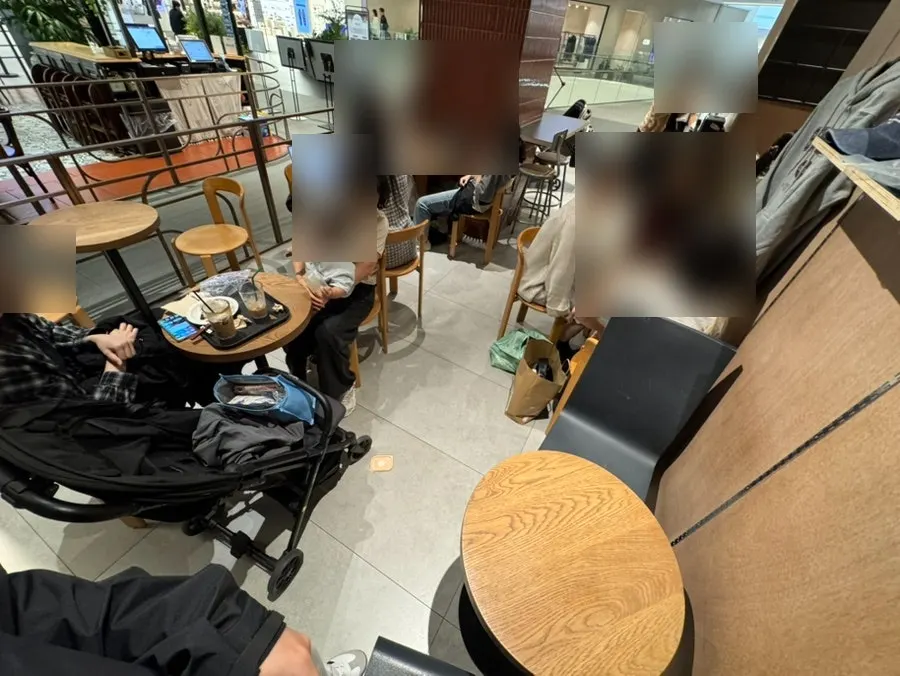 Café seating area nearly full of customers