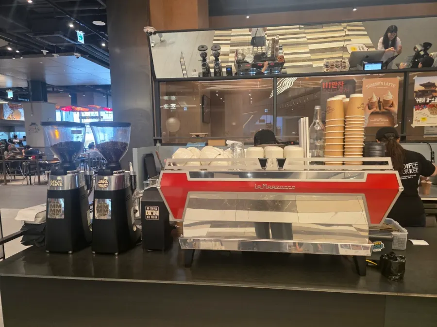 Interior of the café with a one-order-per-person notice