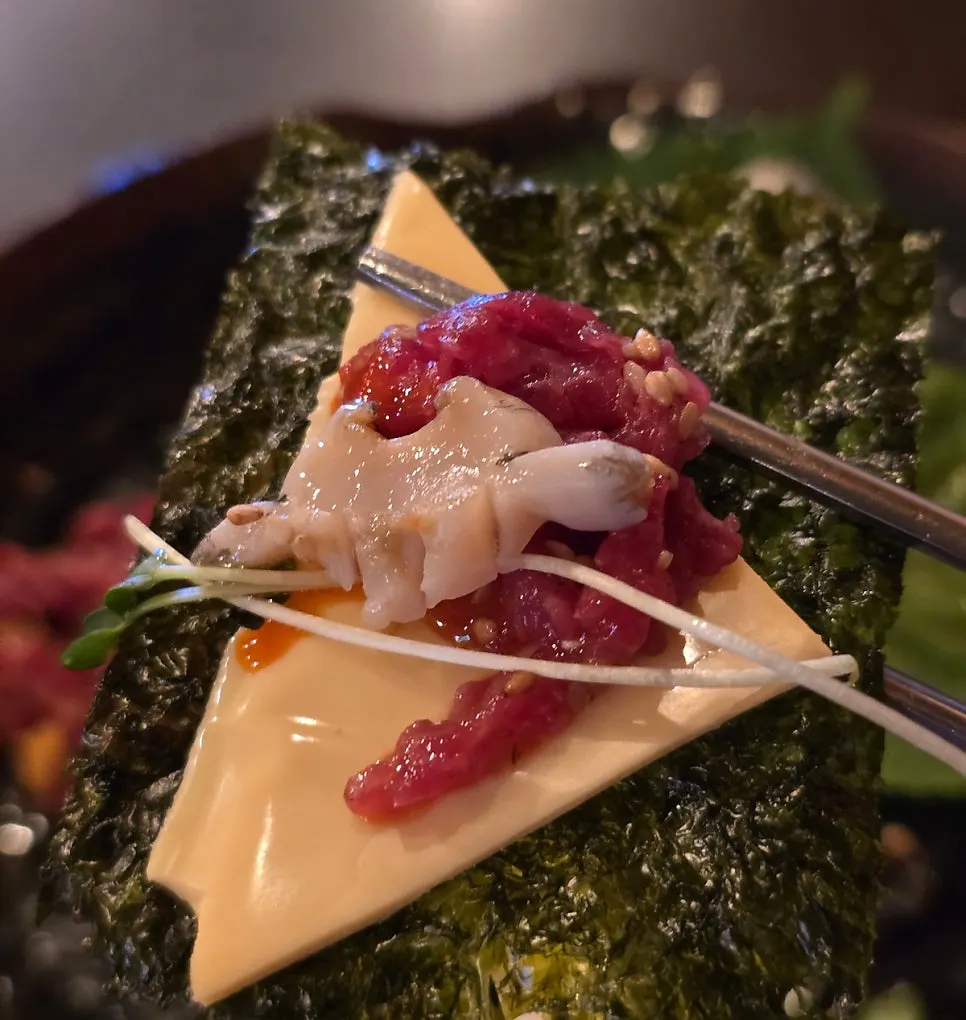 Seaweed topped with cheese, yukhoe, abalone and radish sprouts