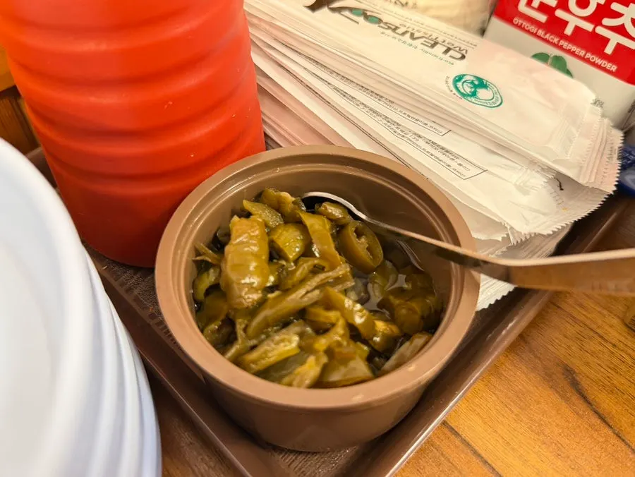 Pickled chili peppers set on the table by default