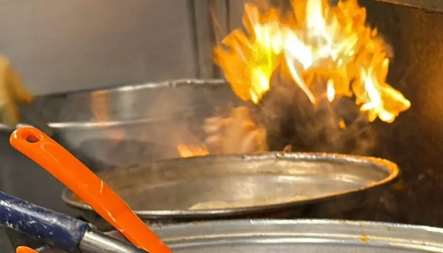 Kitchen area searing smoky flavor into the octopus stir-fry