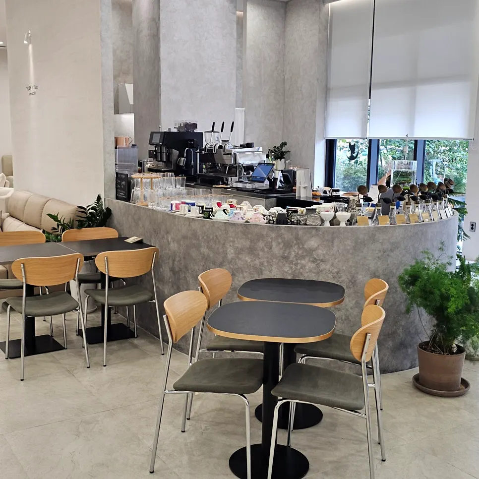 Café space with natural light coming through large windows