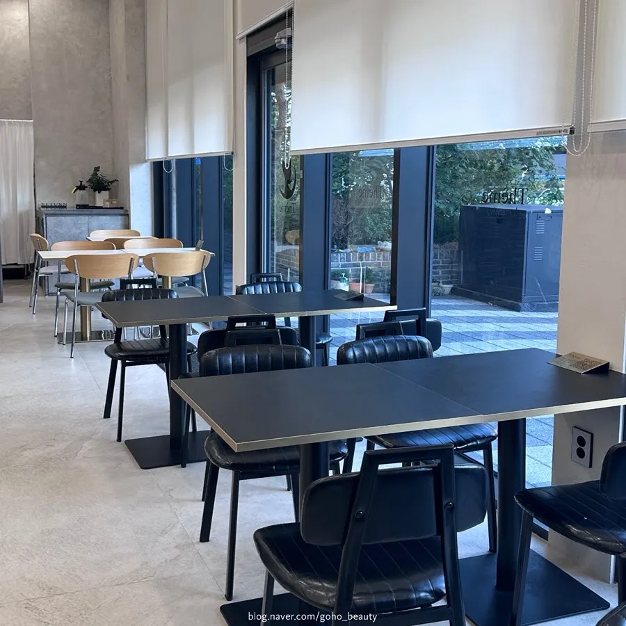 4-person table seating in the high-ceilinged café interior