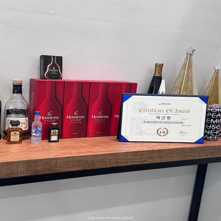 Barista award certificate and displayed coffee cups