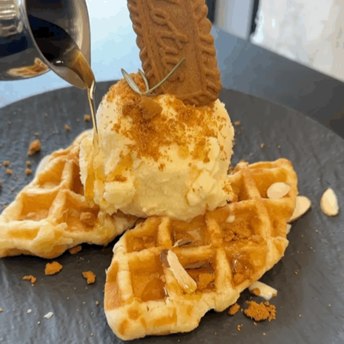 Syrup served separately in a shot glass for the croffle