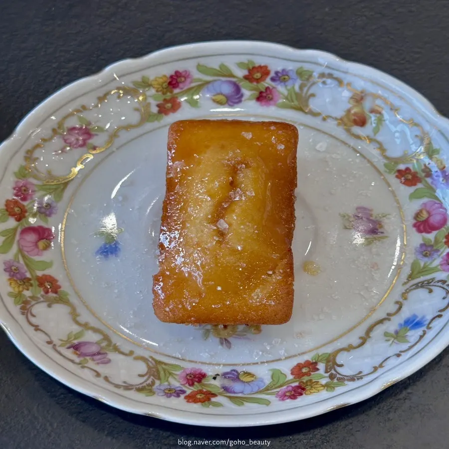 Salted caramel finansier served on a floral vintage plate
