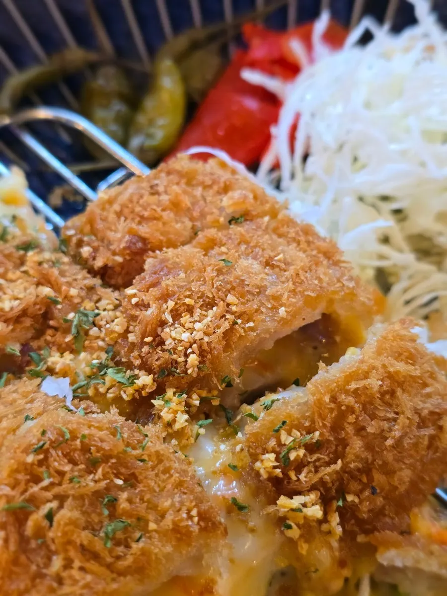 Close-up of a cordon bleu pork cutlet piece