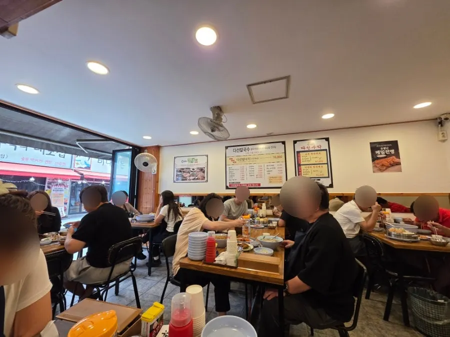 Fully seated dining room at Daseon Kalguksu Main Branch
