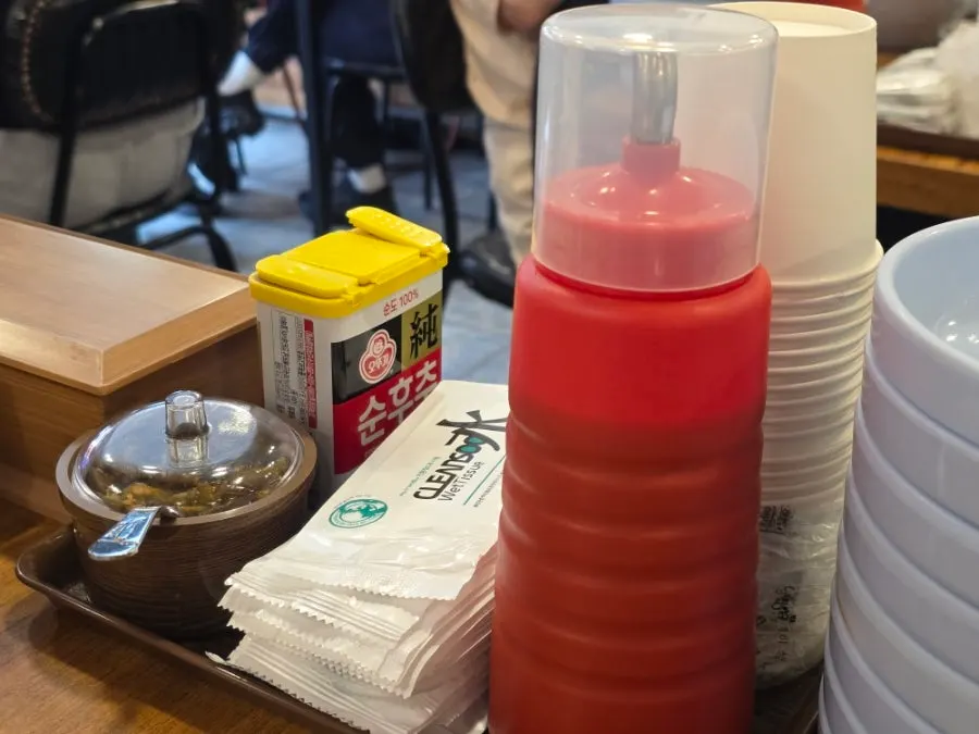 Gochujang, pepper, and spicy peppers on the table