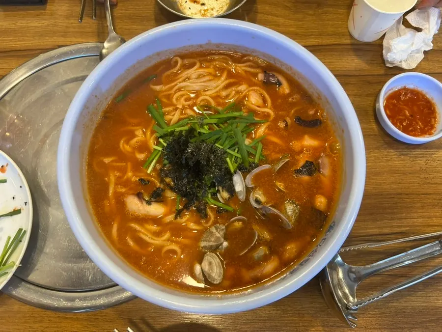 A piece of bossam wrapped in kimchi