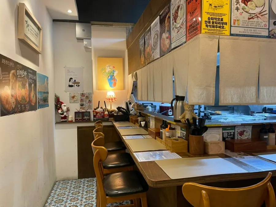 Open kitchen where the cooking process is visible