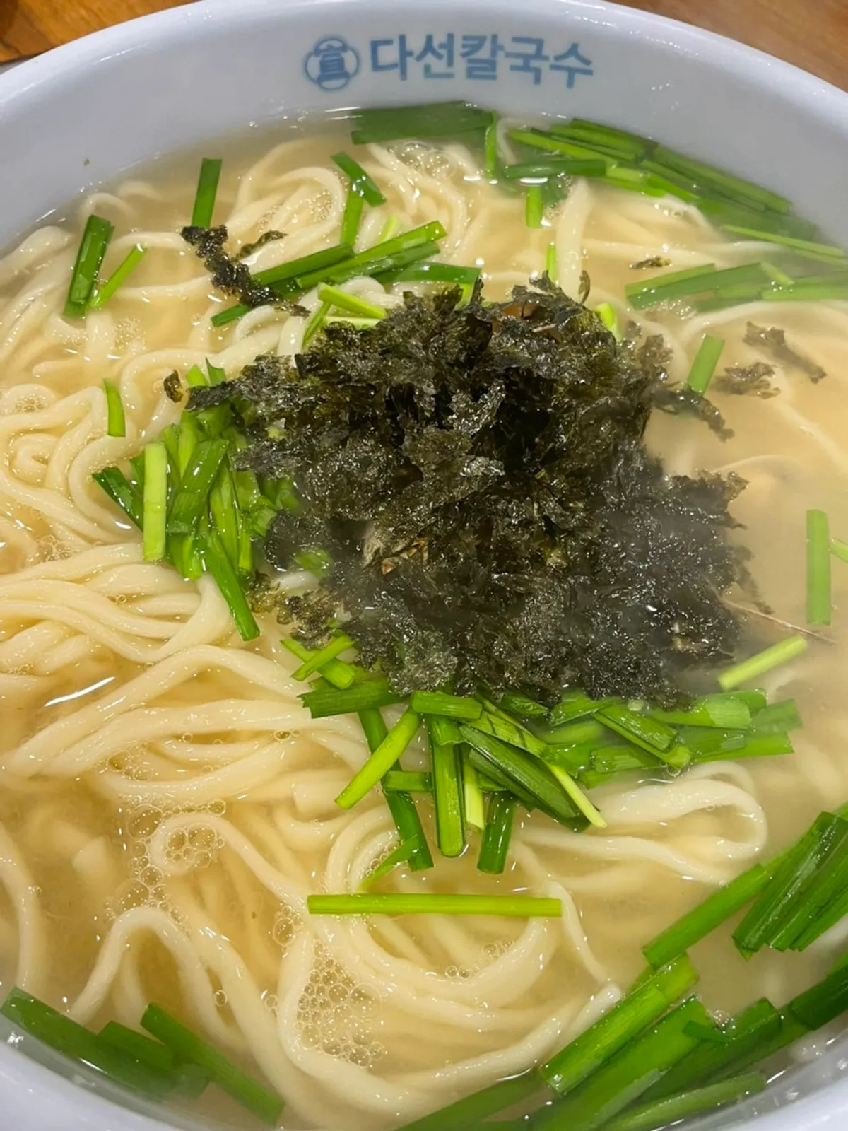 Kalguksu topped with clams and chives
