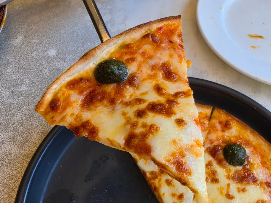 Margherita pizza cut into six slices