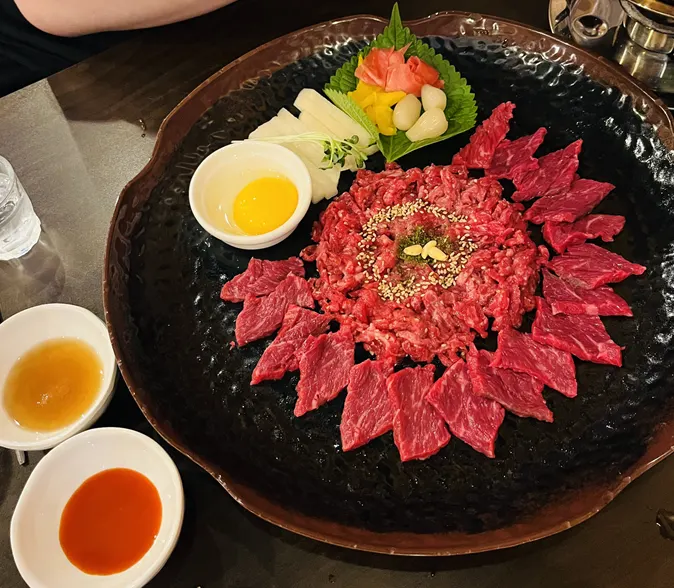 Hanwoo yukhoe served alongside soju