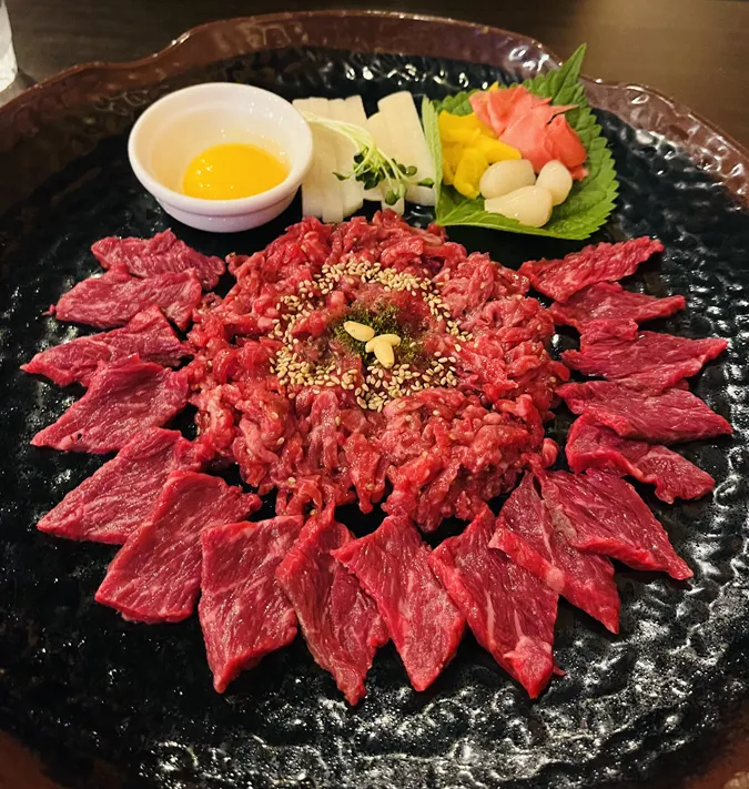 Side dishes and sauces served with the yukhoe combo