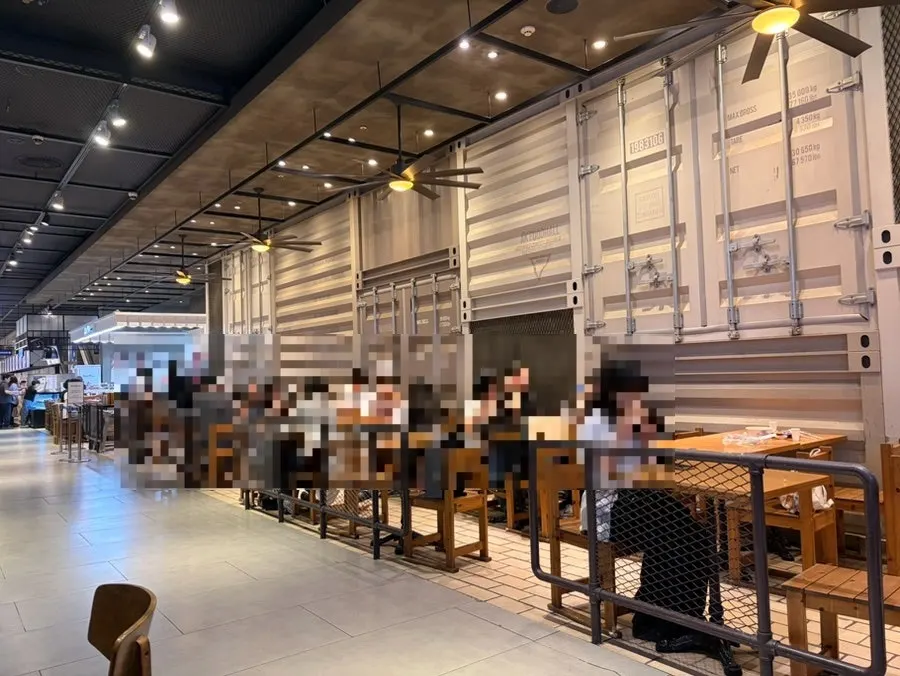 Bar table in front of the shop and food hall seating