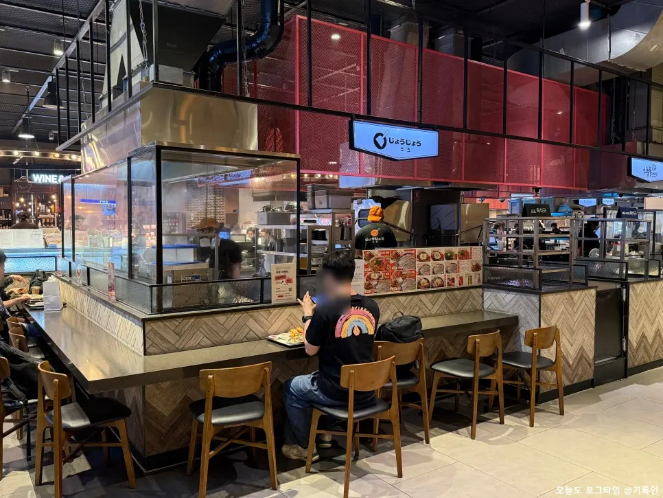 Bar-style seating and adjacent dining area at Jojo