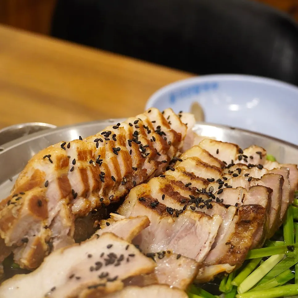 Medium pork bossam served over a gas flame