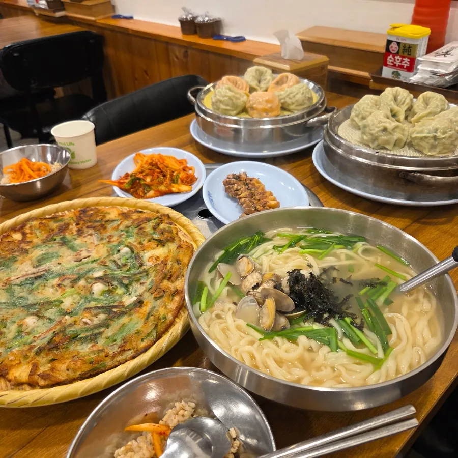 Table set with barley rice and side dishes