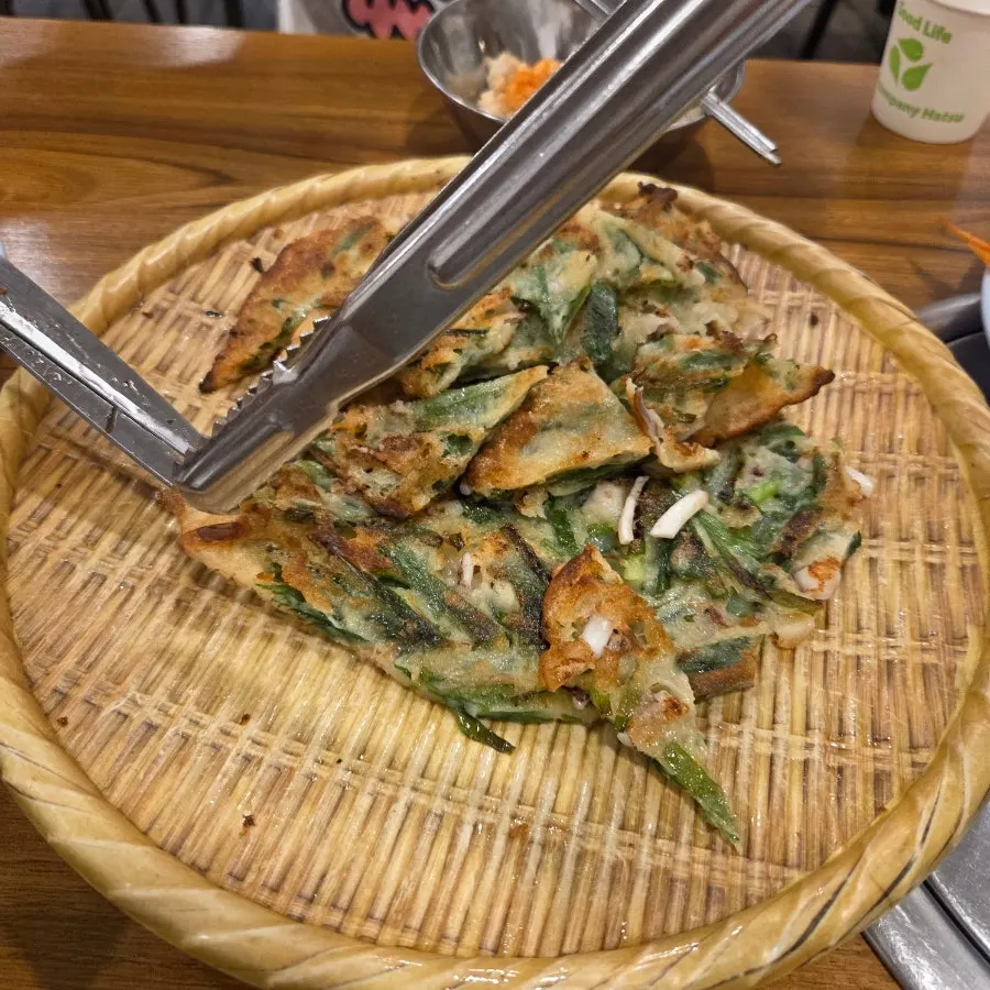 Seafood pajeon served alongside the kalguksu