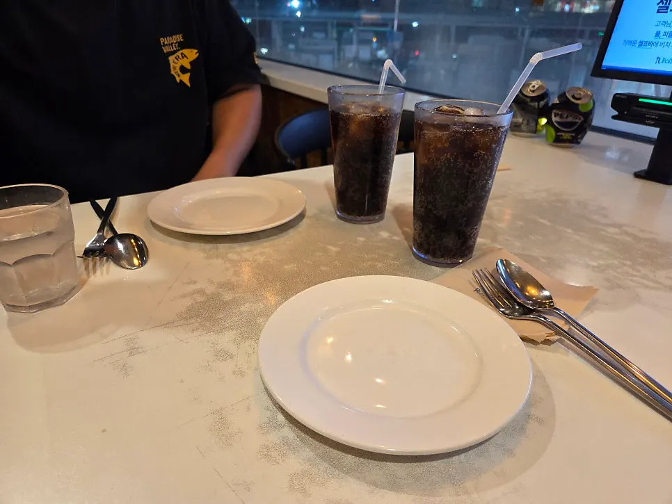 Basic table setting with two zero-sugar colas