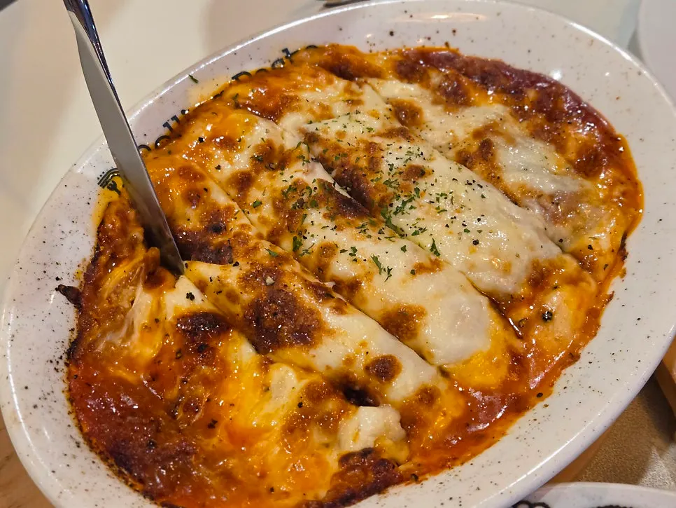 Cross-section of the lasagna with cheese oozing out