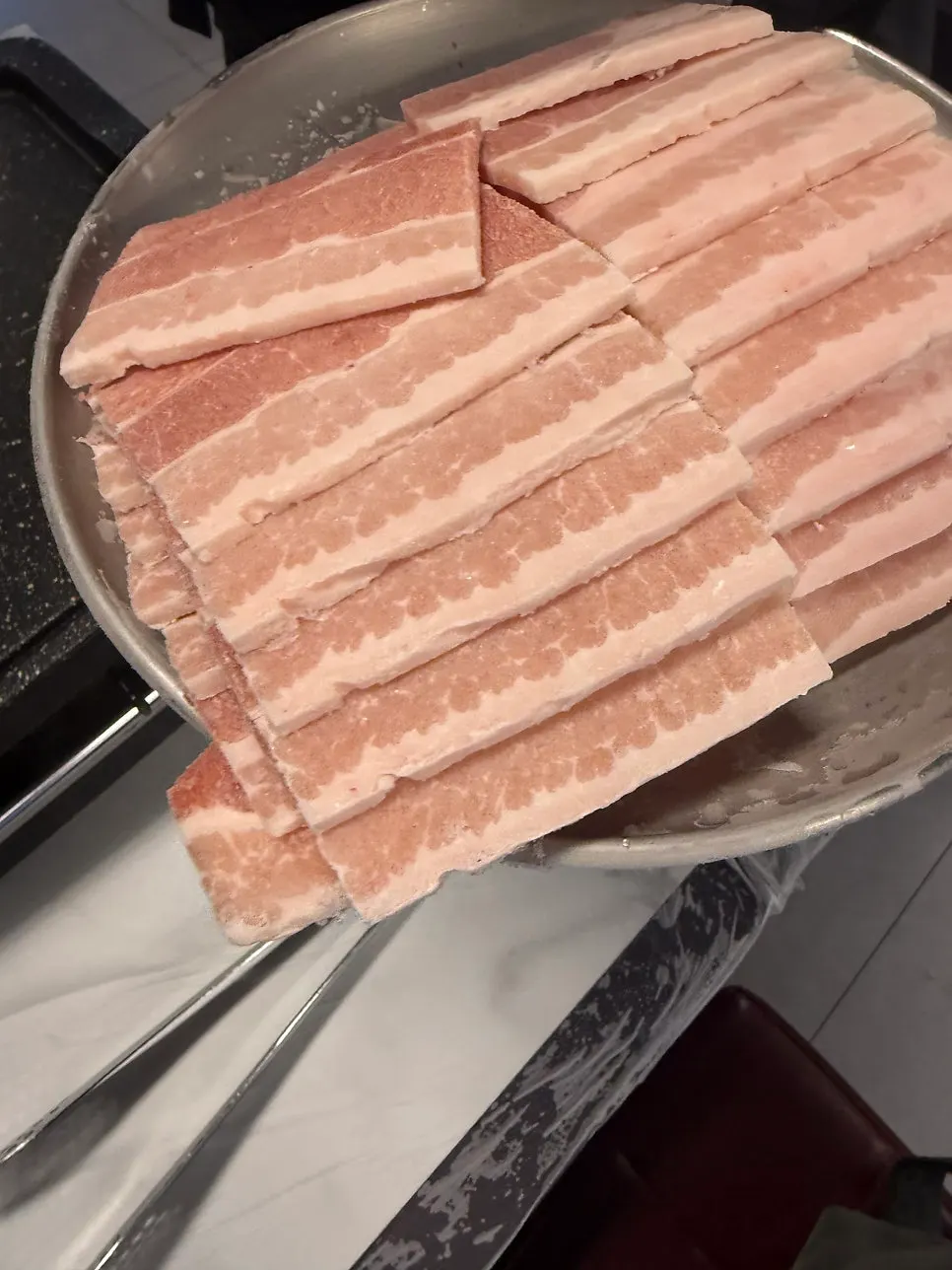 A plate of 3 servings of 4mm frozen pork belly at Taejang Sikdang