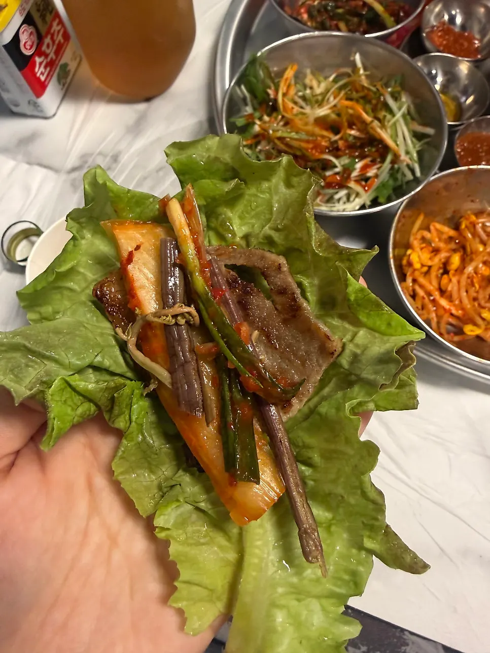 The first round of meat and side vegetables set up by staff