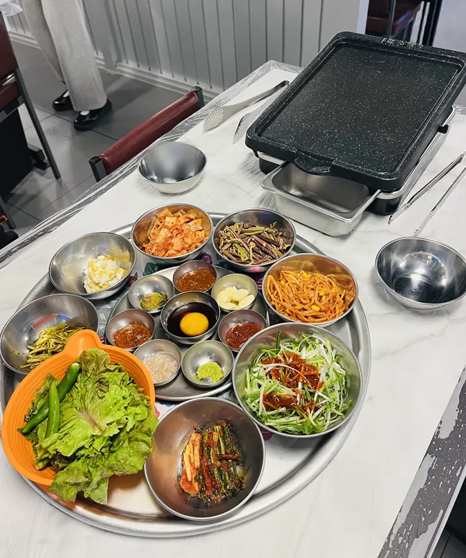 Taejang Sikdang's pork belly and side menu board