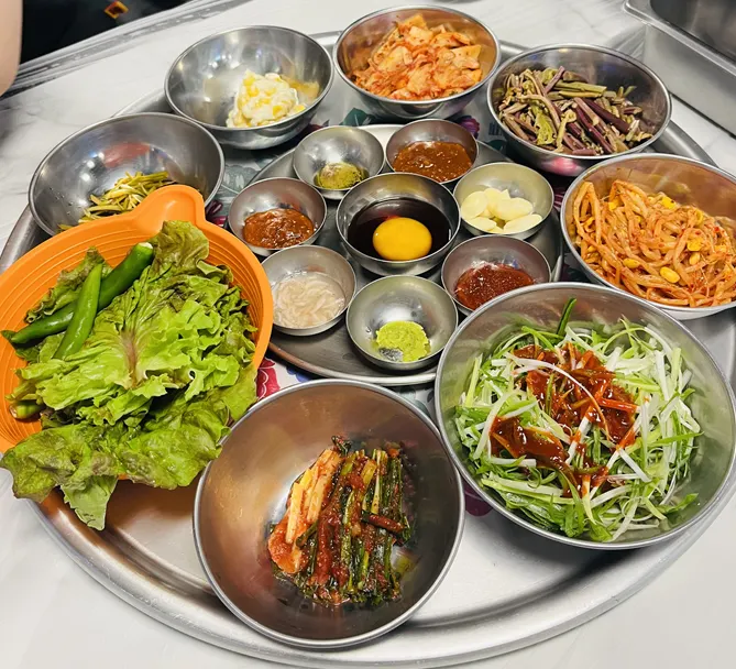 Generous spread of side dishes laid out on the table
