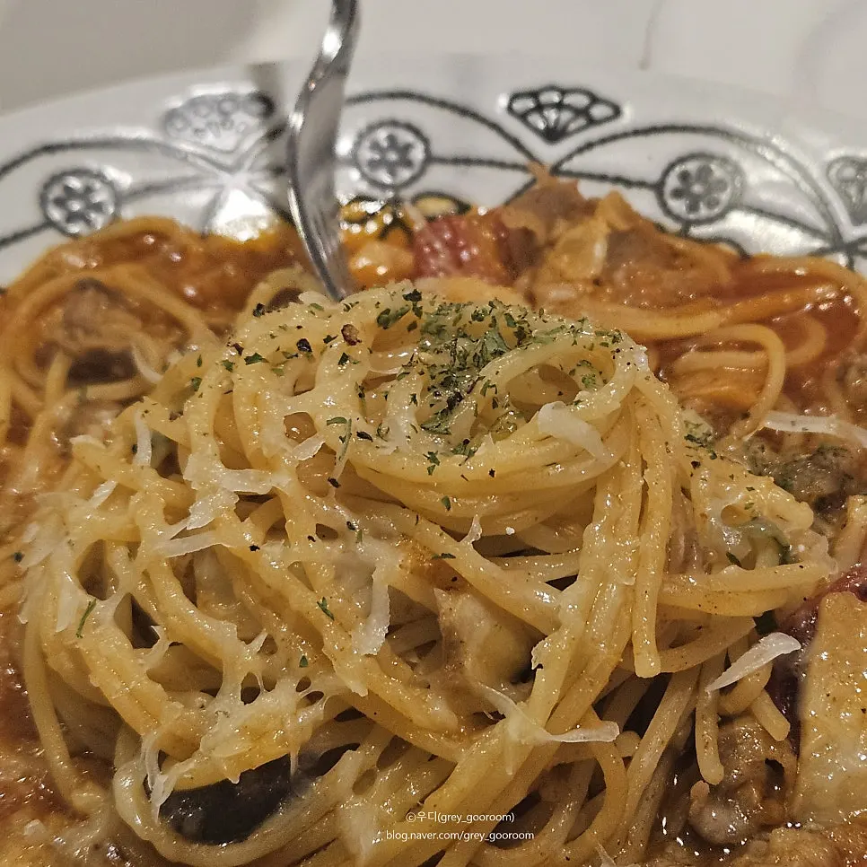 Beef brisket oil pasta twirled on a fork