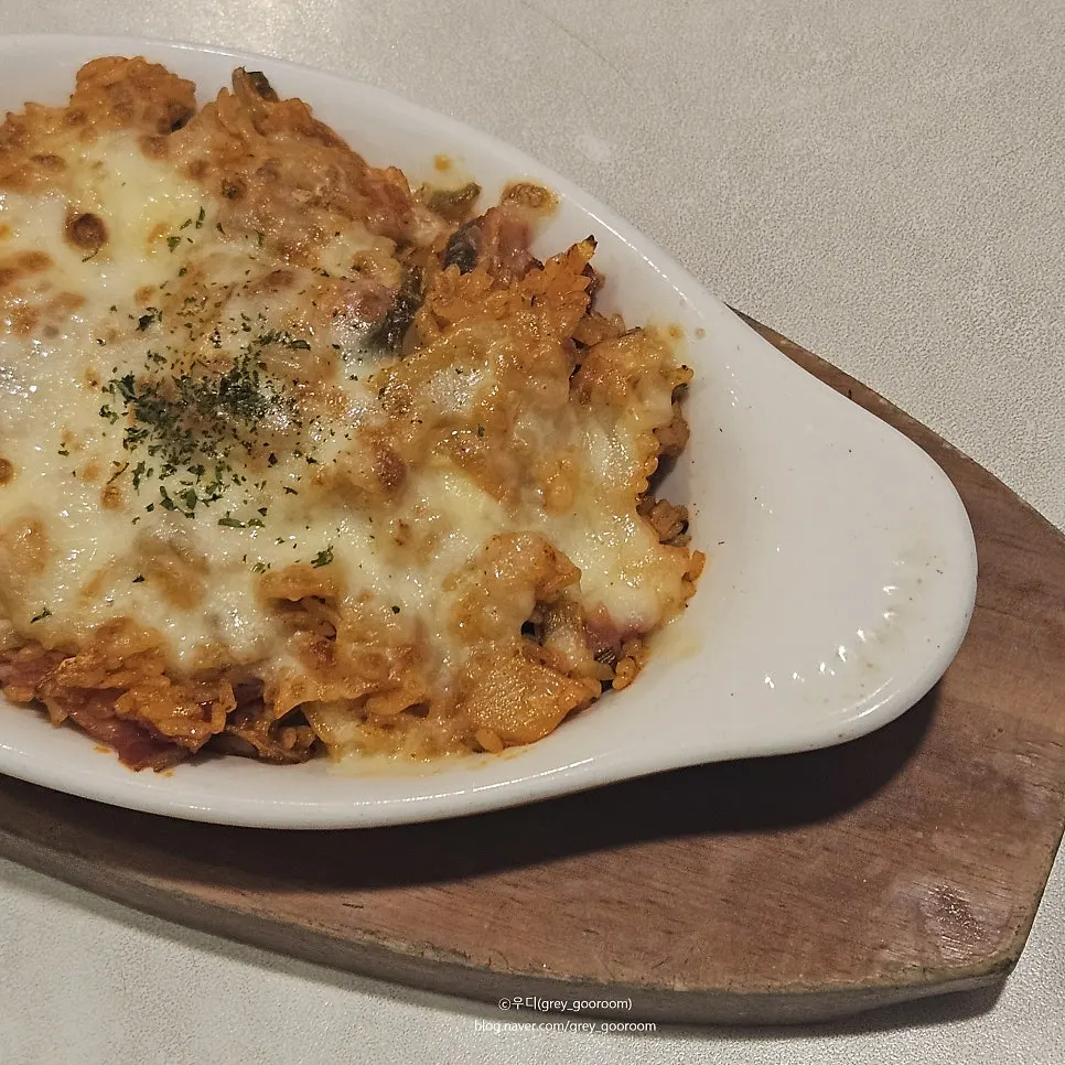 Stretchy cheese pulled from the kimchi fried rice doria