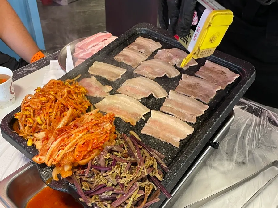 Frozen pork belly placed on the grill