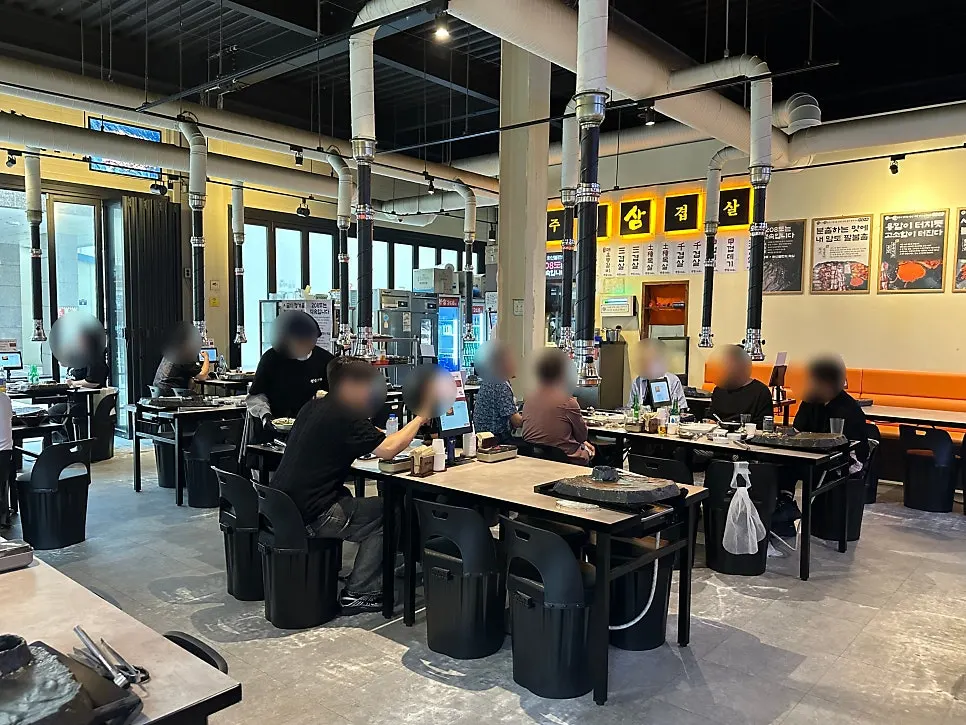 Spacious interior seating at Ssosam 208 Suwon Station Branch