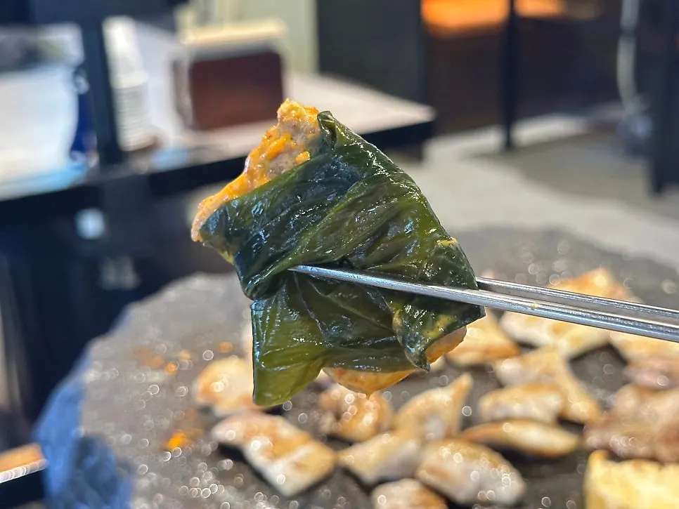 Stone-grilled meat wrapped in wild chive greens