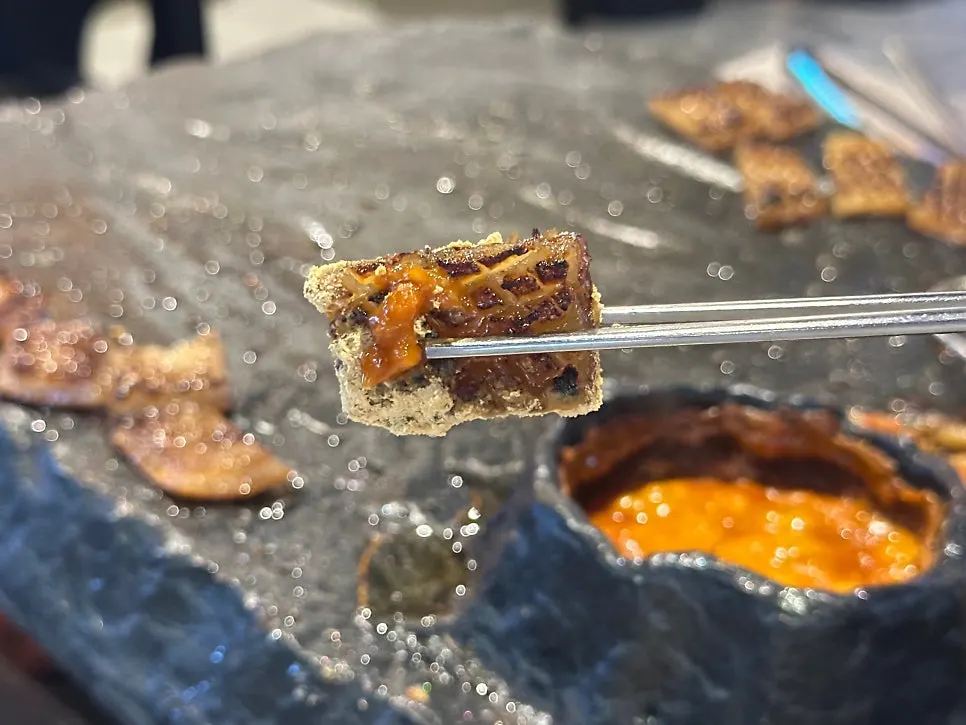 Pork skin grilled crispy on the stone plate