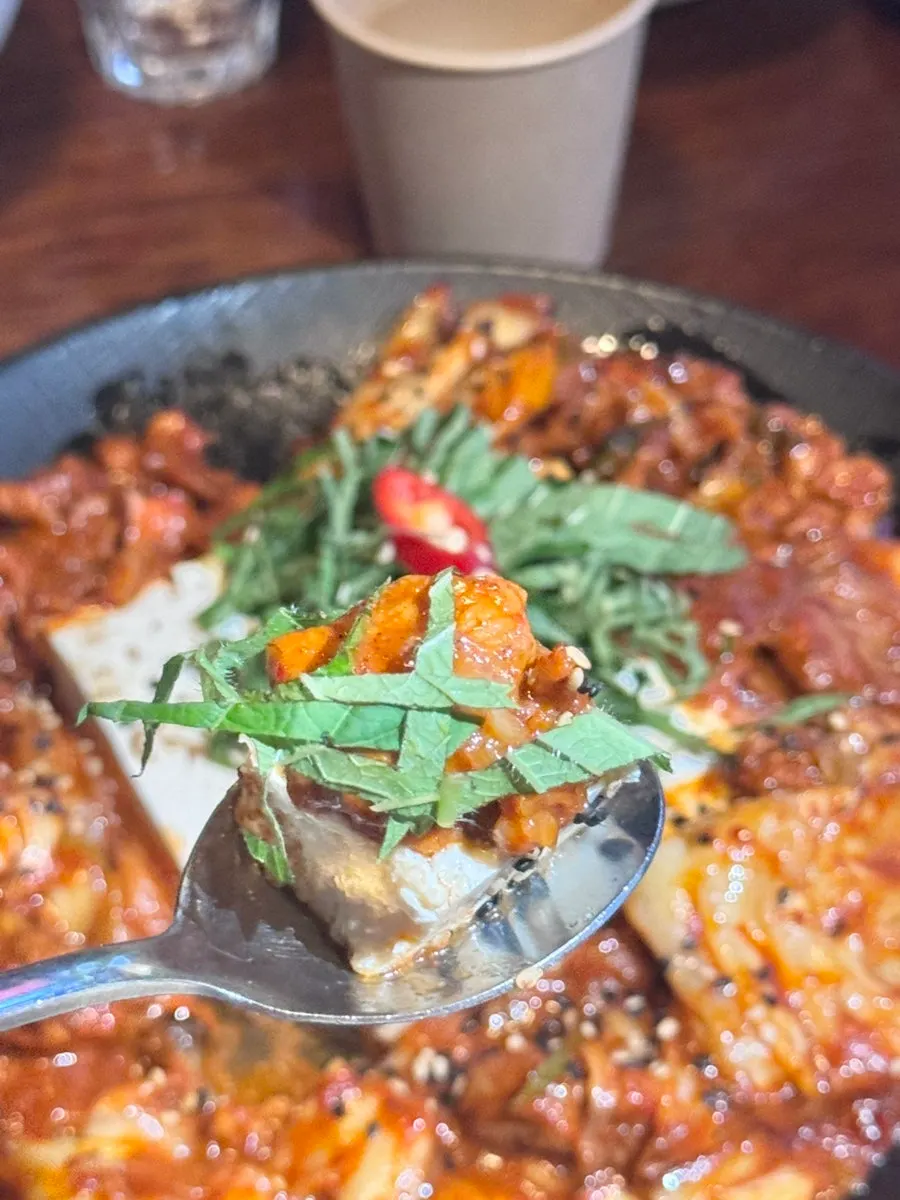 A full serving of tofu half-block spicy pork and kimchi